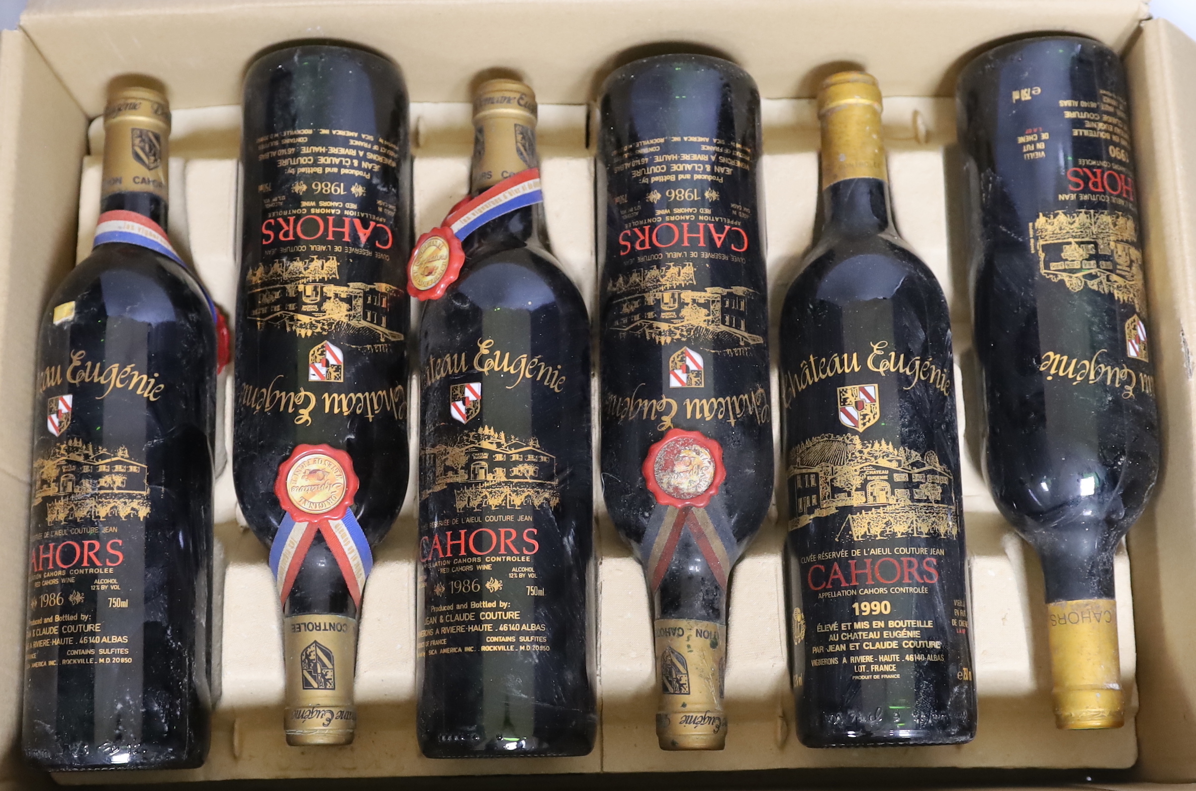 Twelve bottles of Chateau Eugenie, Cahors wine: four bottles 1986, three bottles 1990, three bottles 1986 and one bottle 1987 plus a boxed 1987 magnum (12)